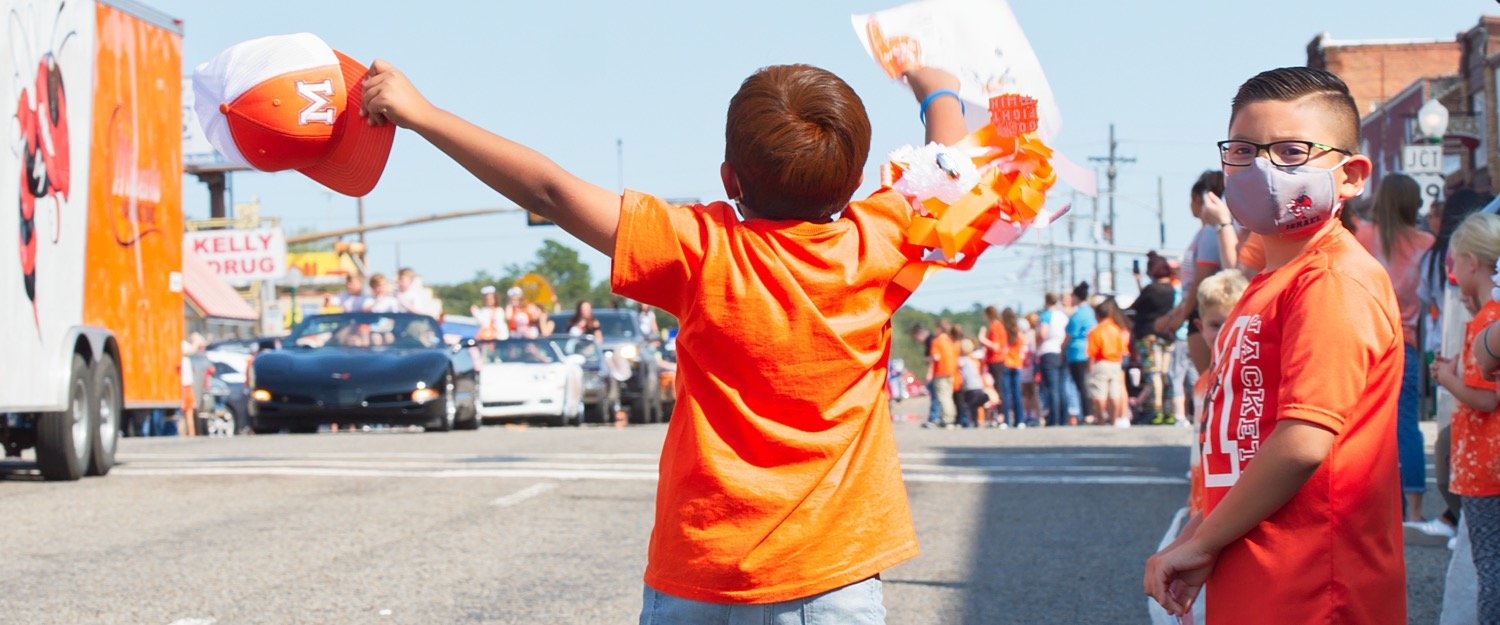 Excitement builds as the Mineola homecoming parade makes its way down Broad St. last Friday afternoon.
